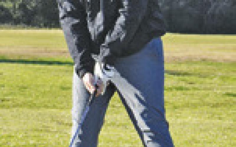 LOGAN BARNES OF Caldwell prepares for this shot on Monday at Copperas Hollow Country Club in Caldwell. The meet was hosted by Lexington. -- Tribune photo by Roy Sanders