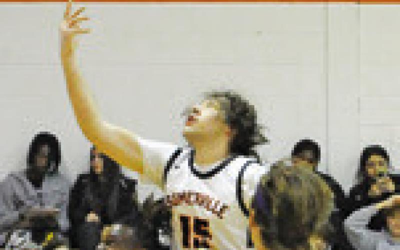 SOMERVILLE’S IRMAN Sadic takes a shot asSnookplayersmovein. Tribune photo by Denise Squier