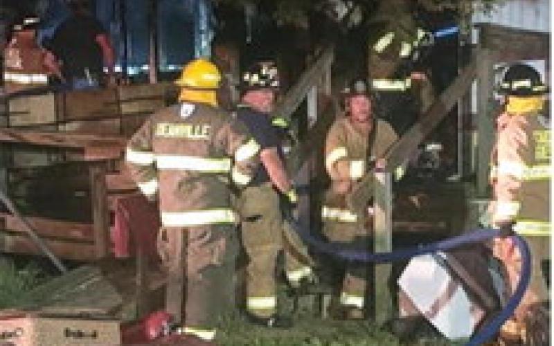 FIREFIGHTERS RESPOND to this house fire on Friday night at Cade Lake. Photo courtesy of Caldwell VFD