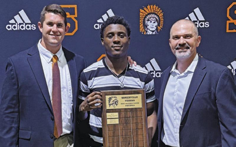 KEITH CRAWFORD, CENTER, was named the 2024-2025 Team MVP for football at the Somerville High School Athletic Banquet. He is pictured with current Athletic Director Luke Klingler and former Athletic Director Philip Roberts.