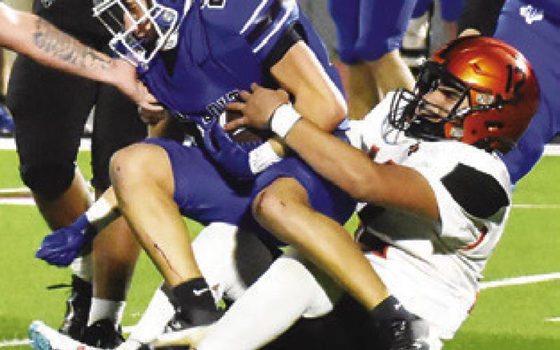 ANDY ESPINOZA makes a tackle against Ben Bolt. Somerville won the area playoff 46-12. Tribune photo by Roy Sanders
