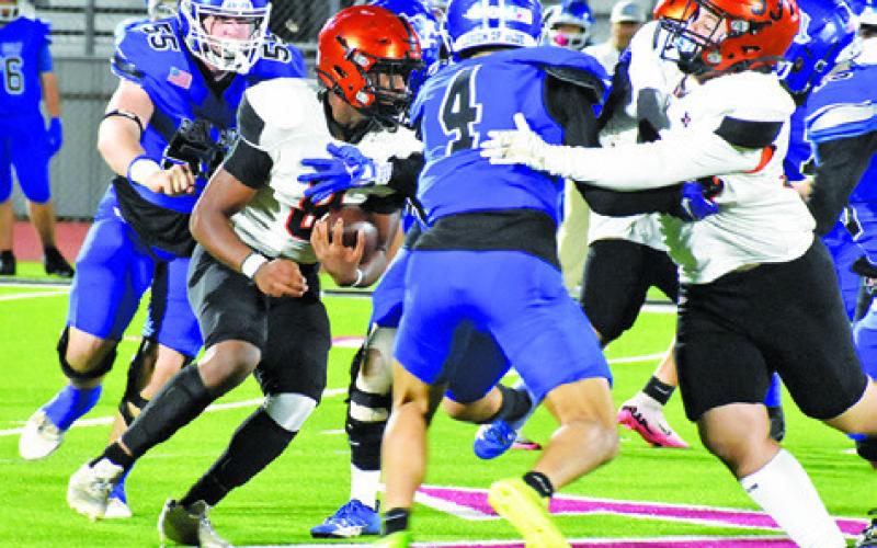 SOMERVILLE’S JA’KEITH Daniels carries for another gain as Luke Moses blocks. The Yeguas won 46-12 in the area playoff. Tribune photo by Roy Sanders