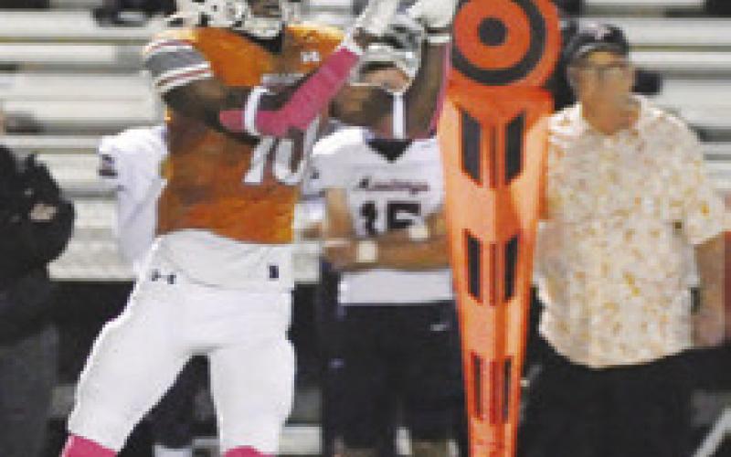CALDWELL’S JIMMY Kearney prepares to catch this pass against Madisonville. Tribune photo by Denise Squier