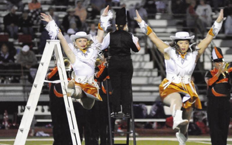 CALDWELL HIGH SCHOOL Honeybees, Kanzie Mantey and Cameron Rodriguez, perform a ladder routine during halftime of the Caldwell-Madisonville football game last Friday night at Hornet Stadium. Tribune photo by Denise Squier
