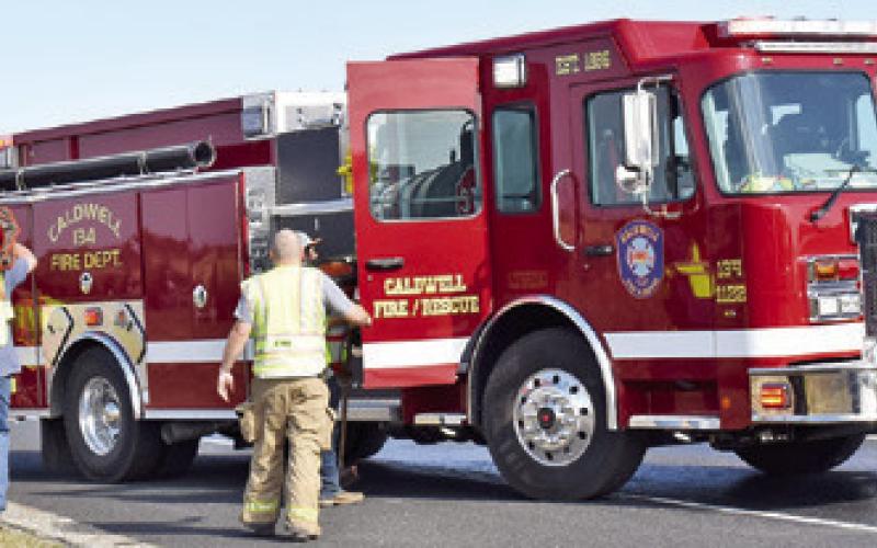 CALDWELL VOLUNTEER FIREFIGHTERS respond last Sunday afternoon, Dec. 1, at this traffic accident off State Highway 21 East near F.M. 2000.