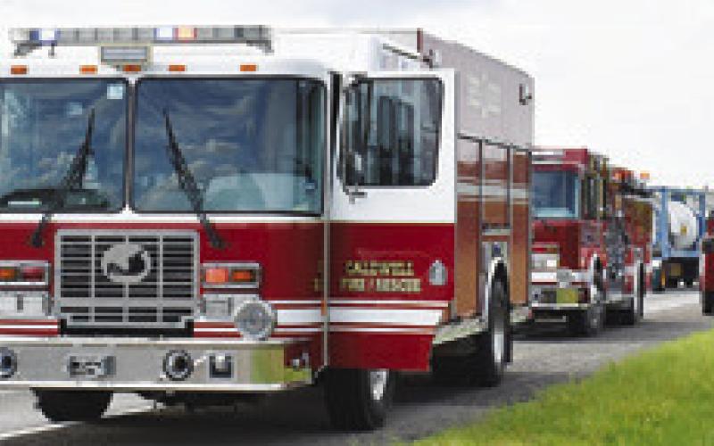THESE CALDWELL FIRE Department trucks respond to the Wednesday, Sept. 4, accident on State Highway 36 South.