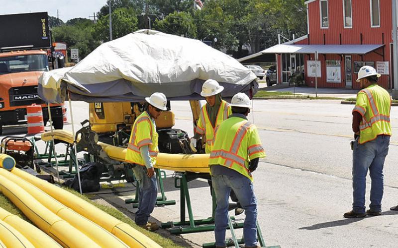 CREWS WORK ON the new Atmos gas line installation project on Monday off State Highway 21.
