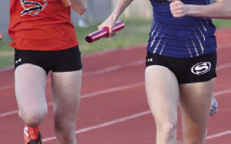 DAKOTA KIENOW closes in on the finish line during a relay at last week’s Kopper Relays. Tribune photo by Roy Sanders