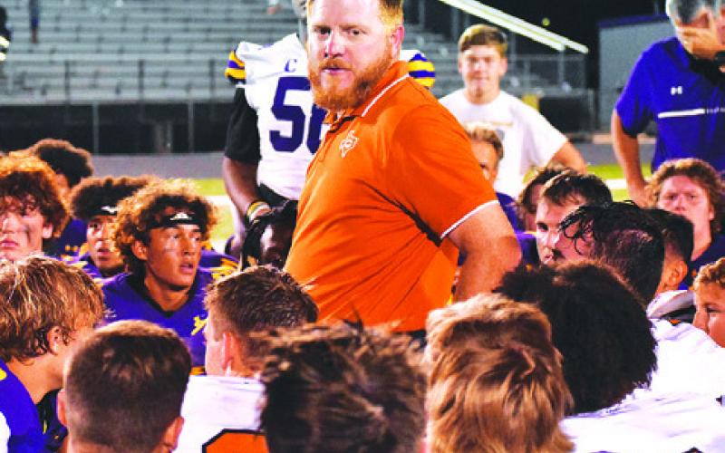 BOONE PATTERSON ADDRESSES Caldwell and La Grange players after the La Grange game. -- Tribune photo by Roy Sanders