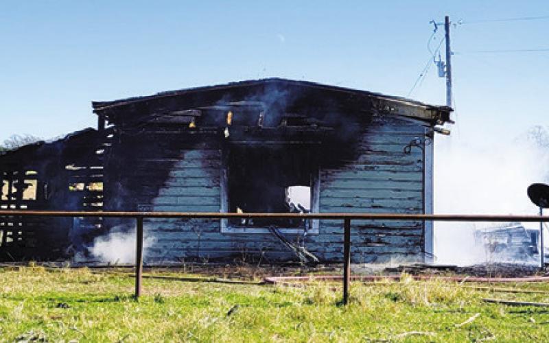 THIS HOUSE IS damaged after a fire on Monday on County Road 244.