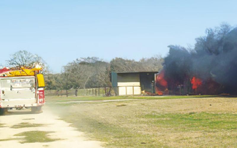 FIREFIGHTERS RESPOND TO this fire off County Road 244. Photo courtesy of Snook VFD