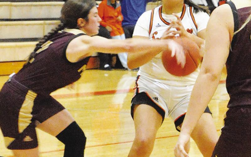 VIVIANA MUNOZ FIGHTS to maintain posession of the ball during the Somerville-Milano game last Friday night in Somerville.