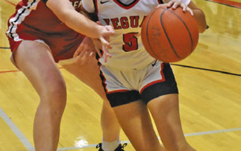 ALEXI ALEJANDRO drives toward the basket during the Somerville-Bremond game on Friday night at Yegua Gym. Tribune photo by Roy Sanders