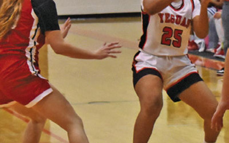 EMMA WILLIAMS tries to find help from a teammate during the Somerville- Bremond game last Friday night. Tribune photo by Roy Sanders