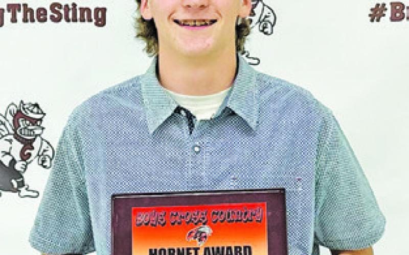 DANIEL BARDIN received the Hornet Award for boys cross country at th Caldwell High School Fall Sports Awards Banquet. Not pictured is MVP winner William McDonald.