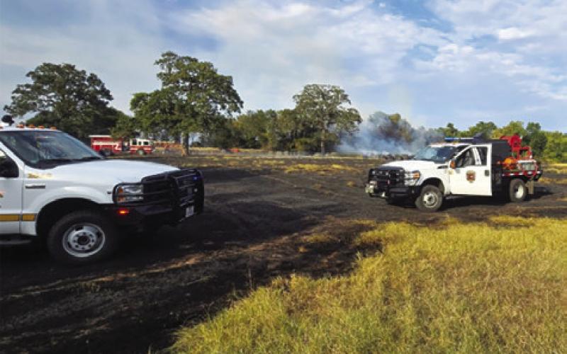 CALDWELL FIREFIGHTERS RESPOND to this pasture fire last Tuesday, Aug. 25, on Private Road 2011 off County Road 333. Photo courtesy of Caldwell Volunteer Fire Department