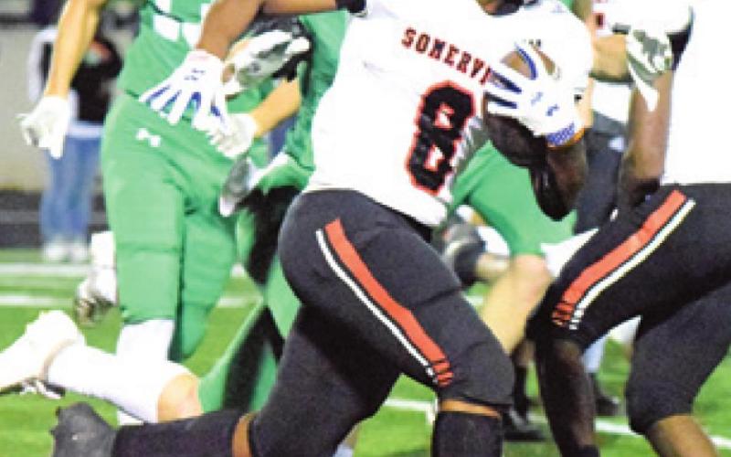 DEVEN GREEN runs with the ball during Somerville’s bi-district game against Eldorado last Thursday night in Burnet.