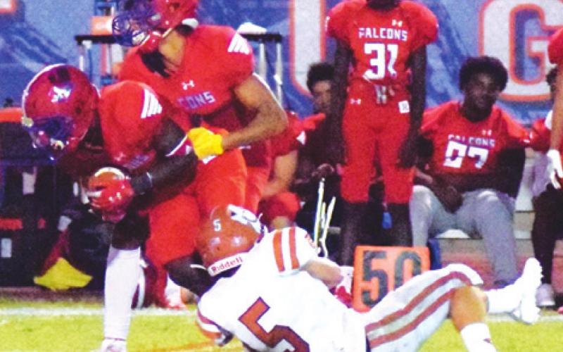 CALDWELL’S JACE ALY hangs onto the ankle of Brookshire Royal’s Zamarion Gibson for the tackle during last Friday night’s game.