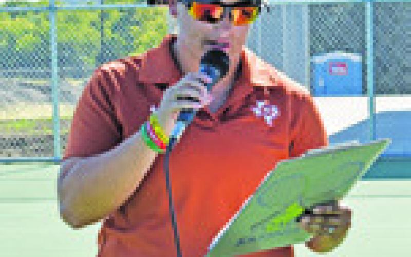COACH MACKENZIE Kassner addresses the crowd before the Caldwell-Cameron Yoe team tennis match last Thursday in Caldwell.