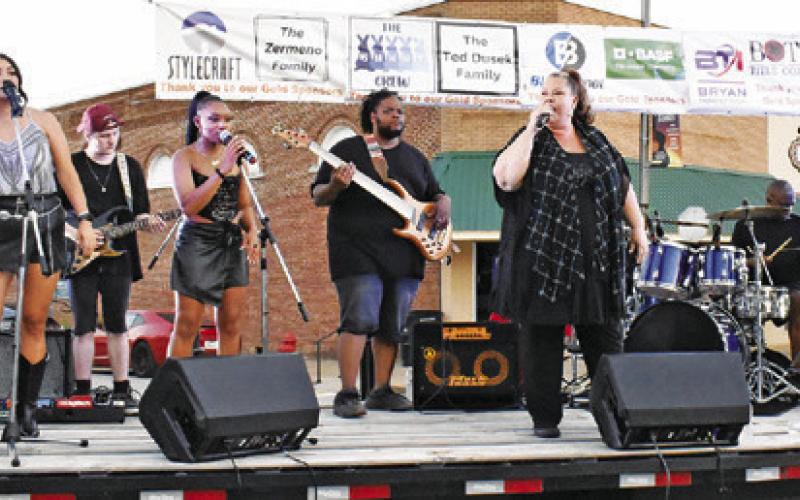 T. COLE AND THE Austin Party Band perform in downtown Caldwell during the Main Street summer concert, the final show of the summer. Tribune photo by Roy Sanders