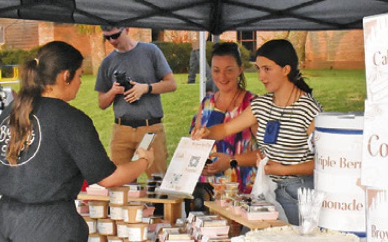 THE SATURDAY NIGHT downtown concert and celebration included numerous vendors around the town square.