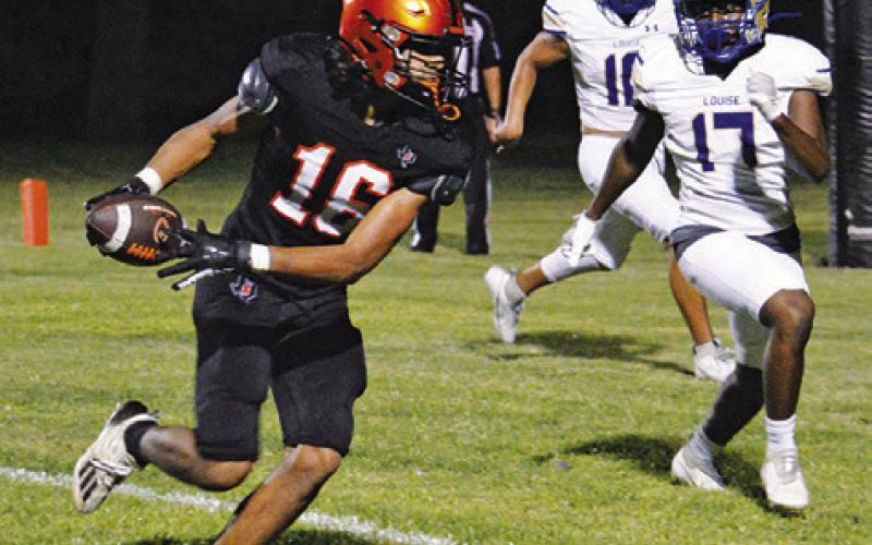 GARDNER SHIVERS OF Somerville makes this catch and rushes to the end zone for a two-point conversion against Louise.