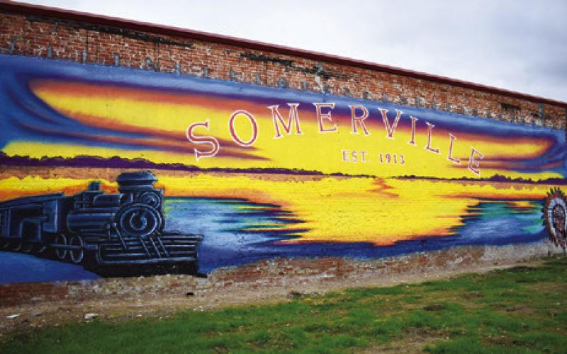 THIS MURAL IS ENJOYED by passersby in Somerville on the back wall of the fire department.