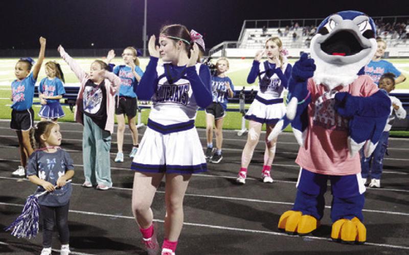 THE SNOOK HIGH School cheerleaders entertain the crowd last Friday at the Snook-Milano football game. Tribune photo by Kim Hutcheson