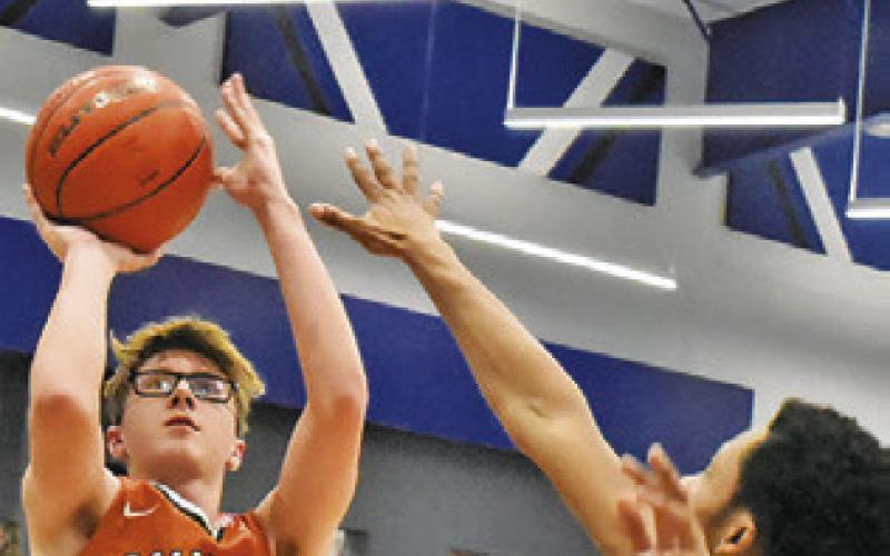 CAYDEN ZBORIL takes a shot against A&amp;amp;M Consolidated JV at the Mumford Tournament. Tribune photo by Roy Sanders