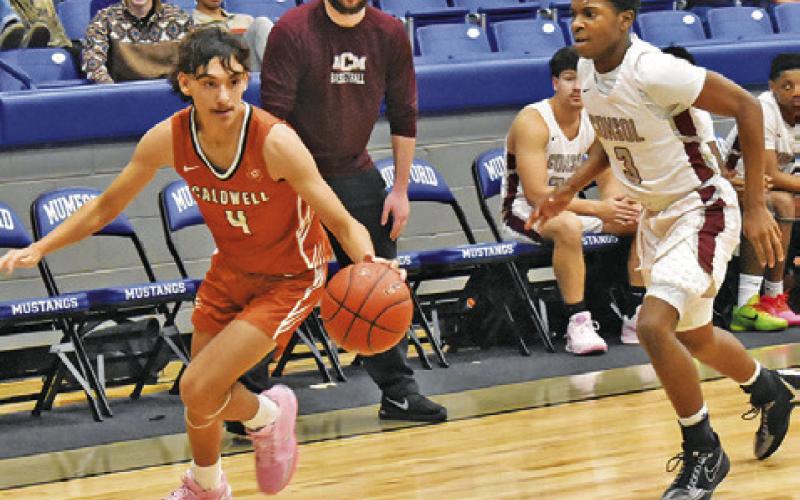 BLANE CASTANEDA DRIBBLES the ball past this A&amp;amp;M Consolidated JV player at the Mumford Tournament last Friday. Tribune photo by Roy Sanders