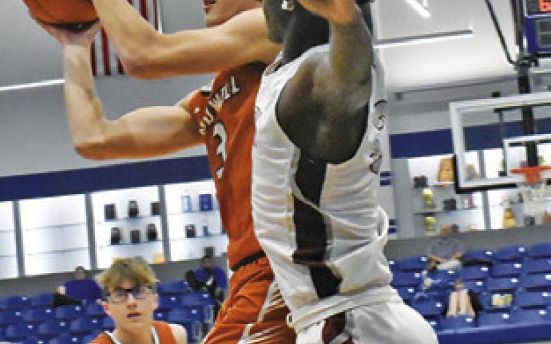 DYLAN CHAPMAN takes a shot for Caldwell against A&amp;amp;M Consolidated JV. Tribune photo by Roy Sanders