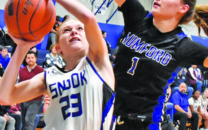 SNOOK’S DAKOTA Kienow attempts to shoot the ball while Mumford’s Allison Scamardodefends. -- Tribune photo by Roy Sanders