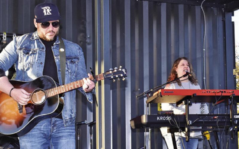 FORGED IN FAITH WAS ONE OF the bands which performed during the “Christmas at Welch Park Music Festival” in Somerville. Pictured, from left, Coleman Wiederhold and Denise Squier. Tribune photo by Roy Sanders