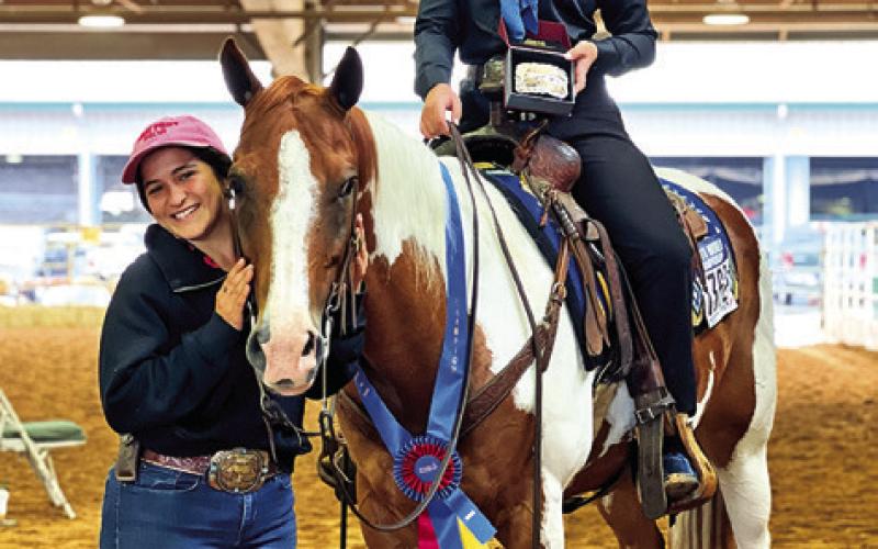 SABINE LAZO IS PICTURED WITH her horse, Heza Hugable Jet, and exhibitor Haven Hundl of College Station after their first win. Photo courtesy of Lazo Performance Horses