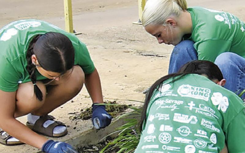 CALDWELL JUNIOR HIGH School students participate in the Big Event service project on Friday, May 15. The students worked on flower beds for this portion at the Caldwell Police Station.