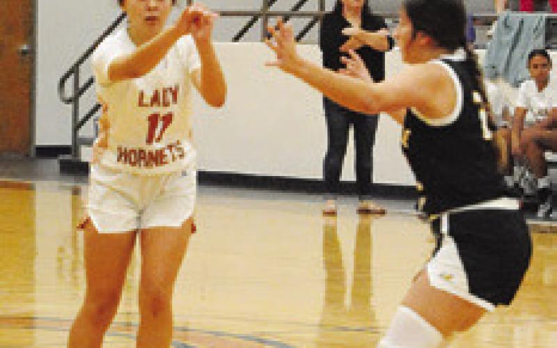 CHASSIDY ROGERS passes the ball to a teammate during the Caldwell-Bruceville Eddy game last Monday in Caldwell.