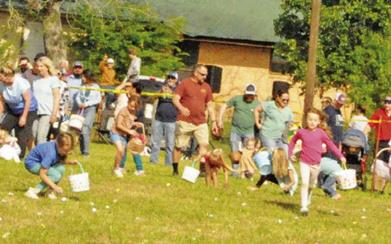 CHILDREN BEGAN RACING TO collect Easter Eggs filled with goodies at First Baptist Church of Caldwell’s Easter Egg Hunt on Saturday.