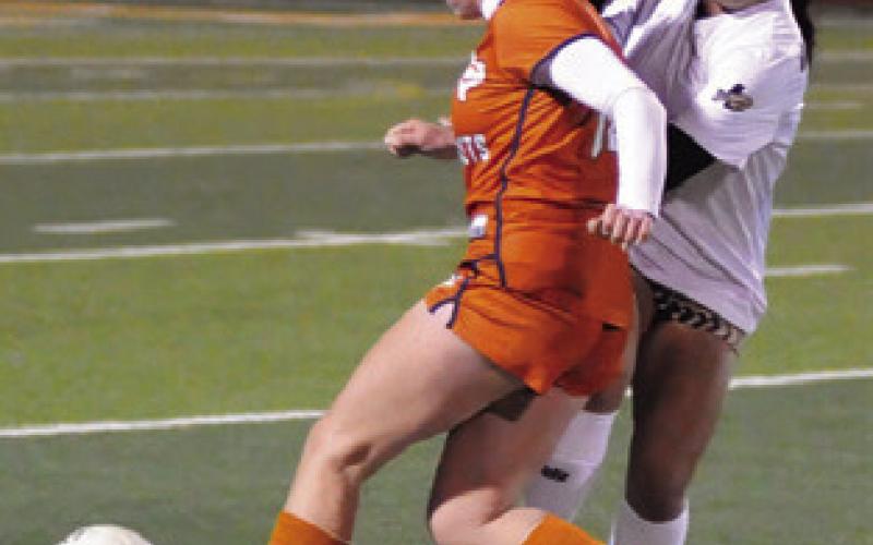 ADELINE HICKS DRIBBLES down the field during the Caldwell-Giddings game last Friday night. Giddings won the game 4-1. Tribune photo by Denise Squier