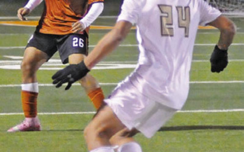 ADRIAN LEYVA sets to defend during the Caldwell-Giddings game last Friday night. Tribune photo by Denise Squier