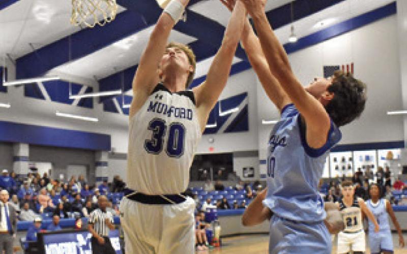 BRAEDYN FANNIN OF Snook fights for this rebound against Mumford last Friday in Mumford. The Bluejays lost 46-21. Tribune photo by Roy Sanders