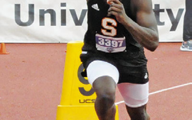 KEITH CRAWFORD runs the first leg of the boys 4x100-meter relay at the UIL Class 2A State Track &amp;amp; Field Meet last Friday.