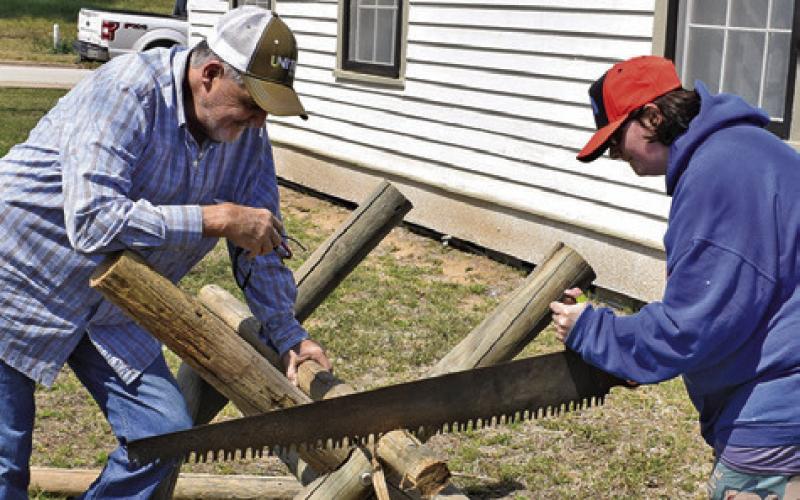 ANTHONY SCHROEDER AND Abby Schroeder do some cutting on Saturday, March 28, at the Burleson County Czech Heritage Museum’s Heritage Day. The day featured several demonstrations.