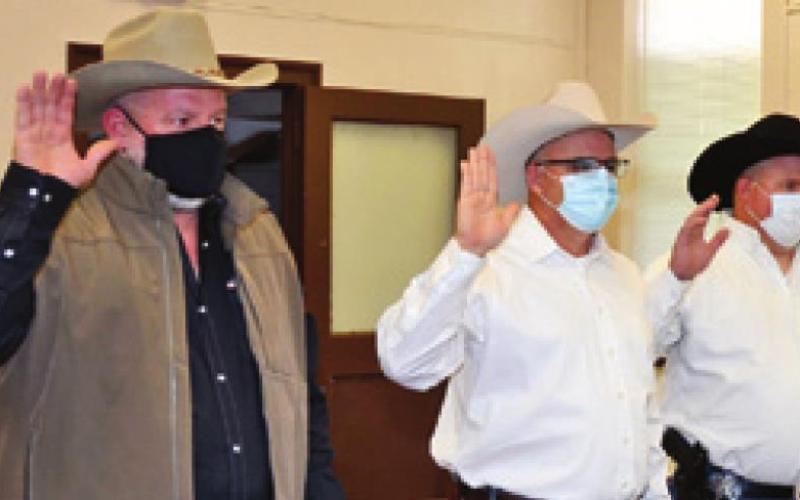 BURLESON COUNTY’S CONSTABLES are sworn into office on Jan. 1. They include, from left, Paul Muzny, Precinct 4, Jay Boykin, Precinct 3, and Jason Muzny, Precinct 1. -- Tribune photo by Roy Sanders