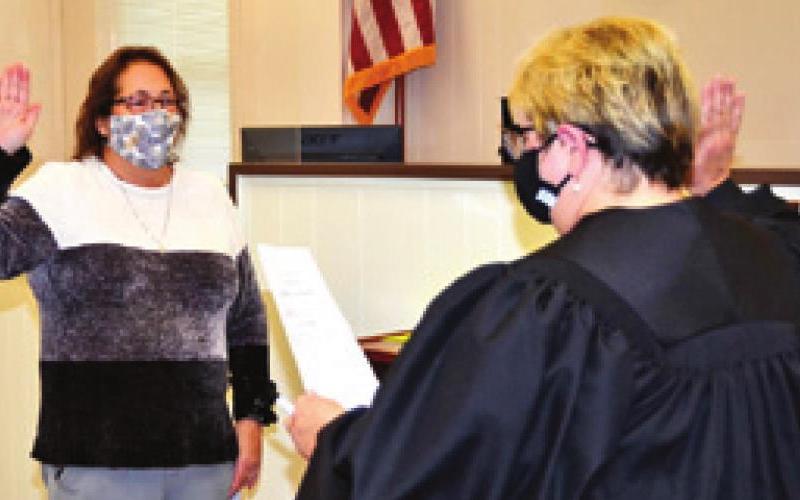 BURLESON COUNTY ATTORNEY Susan Deski is sworn into office by District Judge Reva Towslee Corbett. -- Tribune photo by Roy Sanders
