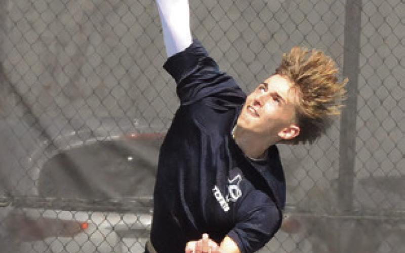 CALDWELL’S DYLAN Chapman is pictured serving at the Caldwell Classic Varsity Tennis Tournament in 2025. Chapman competed at the UIL Class 4A State Tennis Tournament, earning a spot on The Tribune’s Top 10 Sports of 2025 list. Tribune photo by Denise Squier