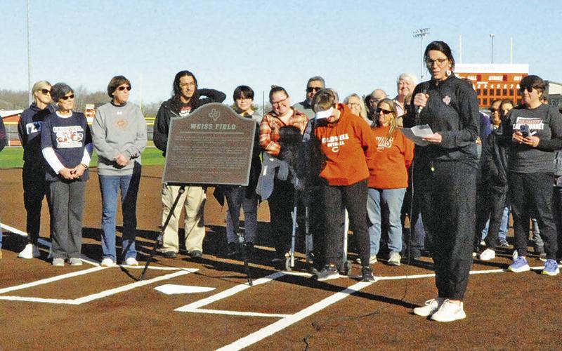 LONGTIME LADY HORNET softball coach Wendy Weiss was honored during 2025 by Caldwell ISD and the Caldwell community renaming the Lady Hornet’s softball field “Weiss Field.” Pictured is Caldwell Assistant Athletic Director Jane Anne Giese giving the official dedication speech for the field’s new name. The renaming of the field was one of the top sports stories in The Tribune in 2025. Tribune photo by Denise Squier