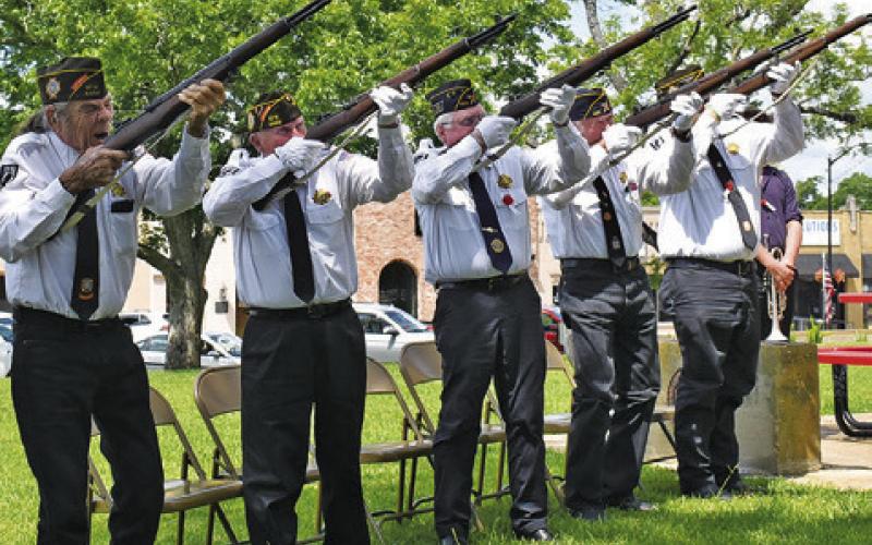 THE CALDWELL VFW Post Rifle Honor Guard fires their volleys on Monday during the annual Memorial Day ceremony.