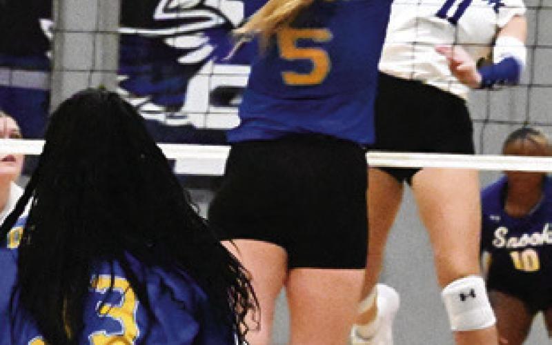 MABRY PRIHODA attempts to get the ball past a Dime Box player during the Snook-Dime Box match last Friday afternoon. Tribune photo by Denise Squier