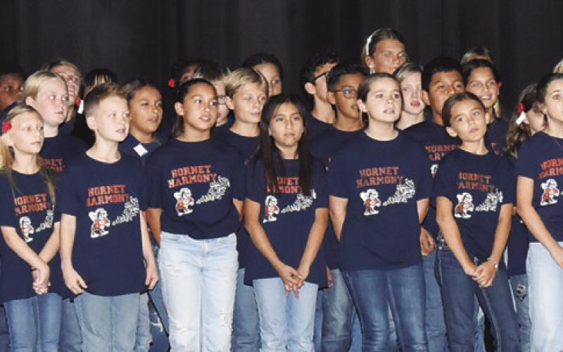 THE CALDWELL INTERMEDIATE SCHOOL Choir performs at the Veterans Day ceremony. Tribune photo by Roy Sanders