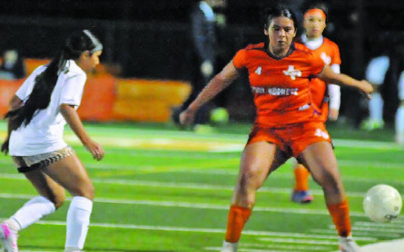CALDWELL’S ISABELLE HERNANDEZ kicks the ball out of bounds to stop a Giddings’ drive during the Lady Hornets’ game against the Lady Buffs on Friday night at Hornet Field. Giddings won the game 4-1. Tribune photo by Denise Squier